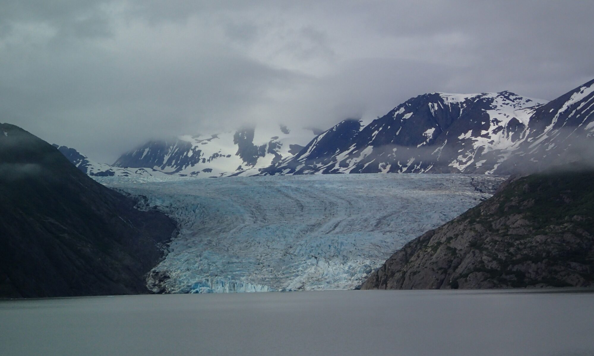 Skilak glacier on a cloudy day as seen from the ice contact lake near Pothole Lake
